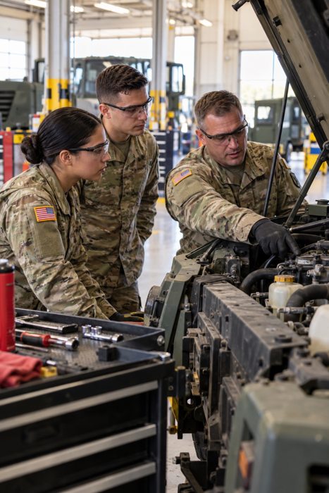 Soldiers learning vehicle maintenance